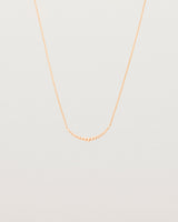 Front view of the Crescent Necklace in Rose Gold.