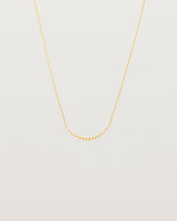 Front view of the Crescent Necklace in yellow gold.