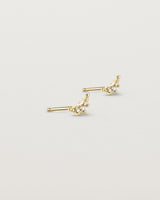 Angled view of the Crescent Studs | Diamonds in yellow gold.