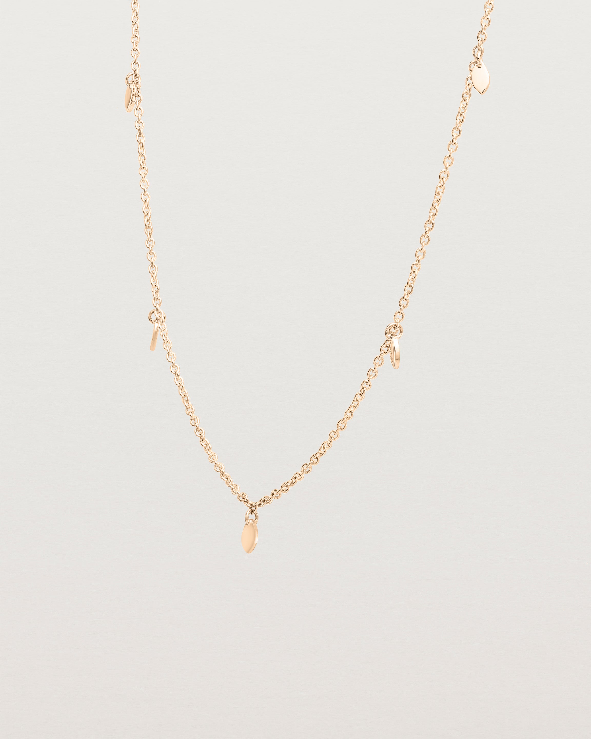 Angled view of the Daisy Chain Necklace | Rose Gold.