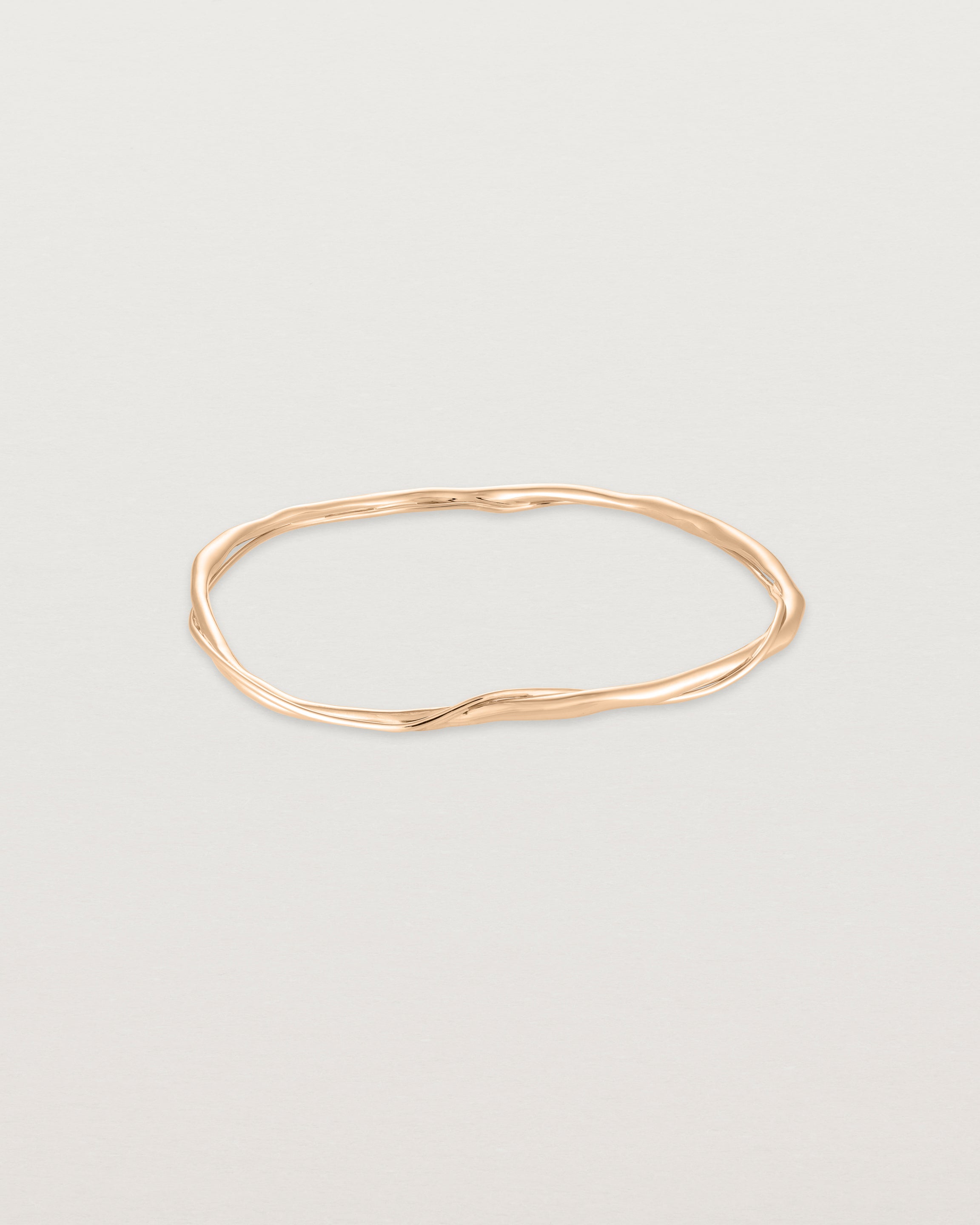 Front view of the Dalí Bangle in rose gold