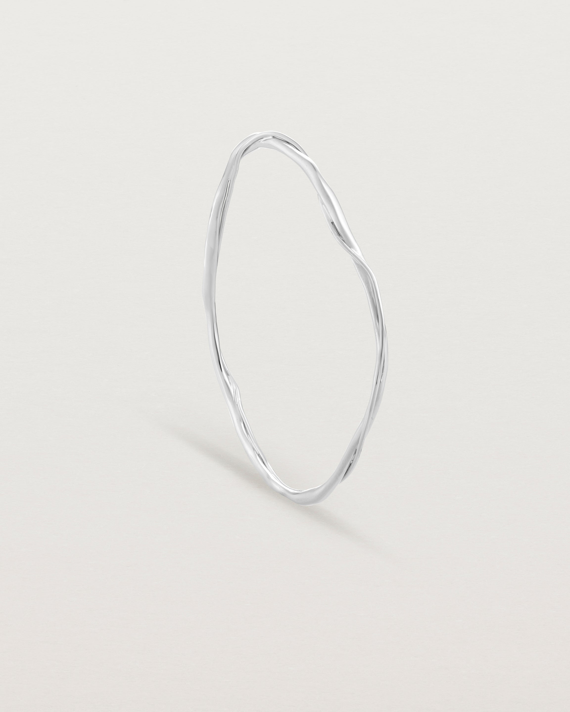 Standing view of the Dalí Bangle in sterling silver.