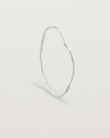 Standing view of the Dalí Bangle in sterling silver.