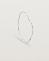 Standing view of the Dalí Bangle in sterling silver.