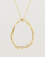 Angled view of the Dalí Necklace in yellow gold.Front view of the Dalí Necklace in yellow gold.