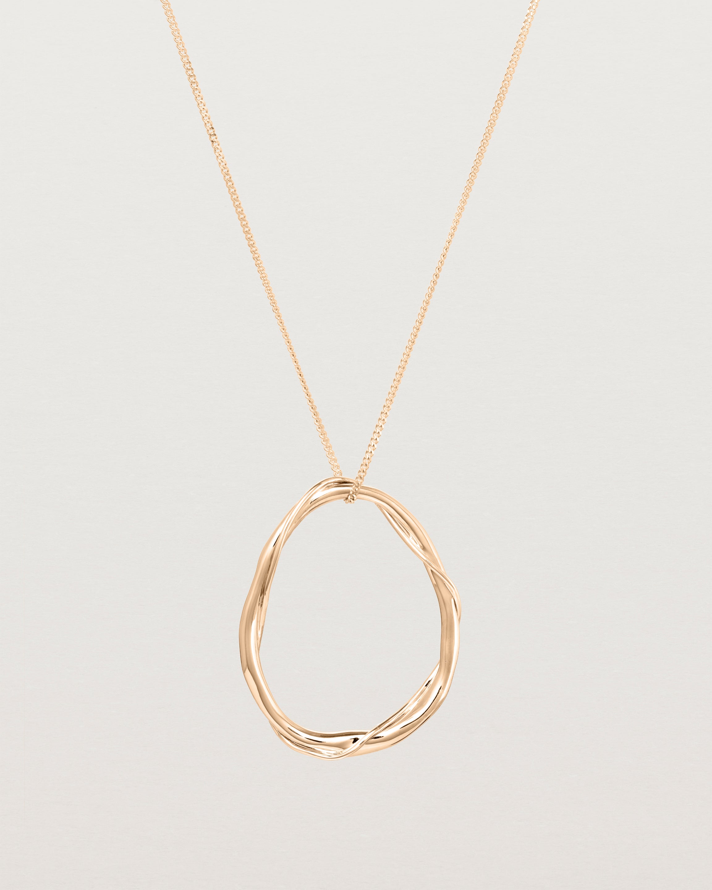 Front view of the Dalí Necklace in rose gold.