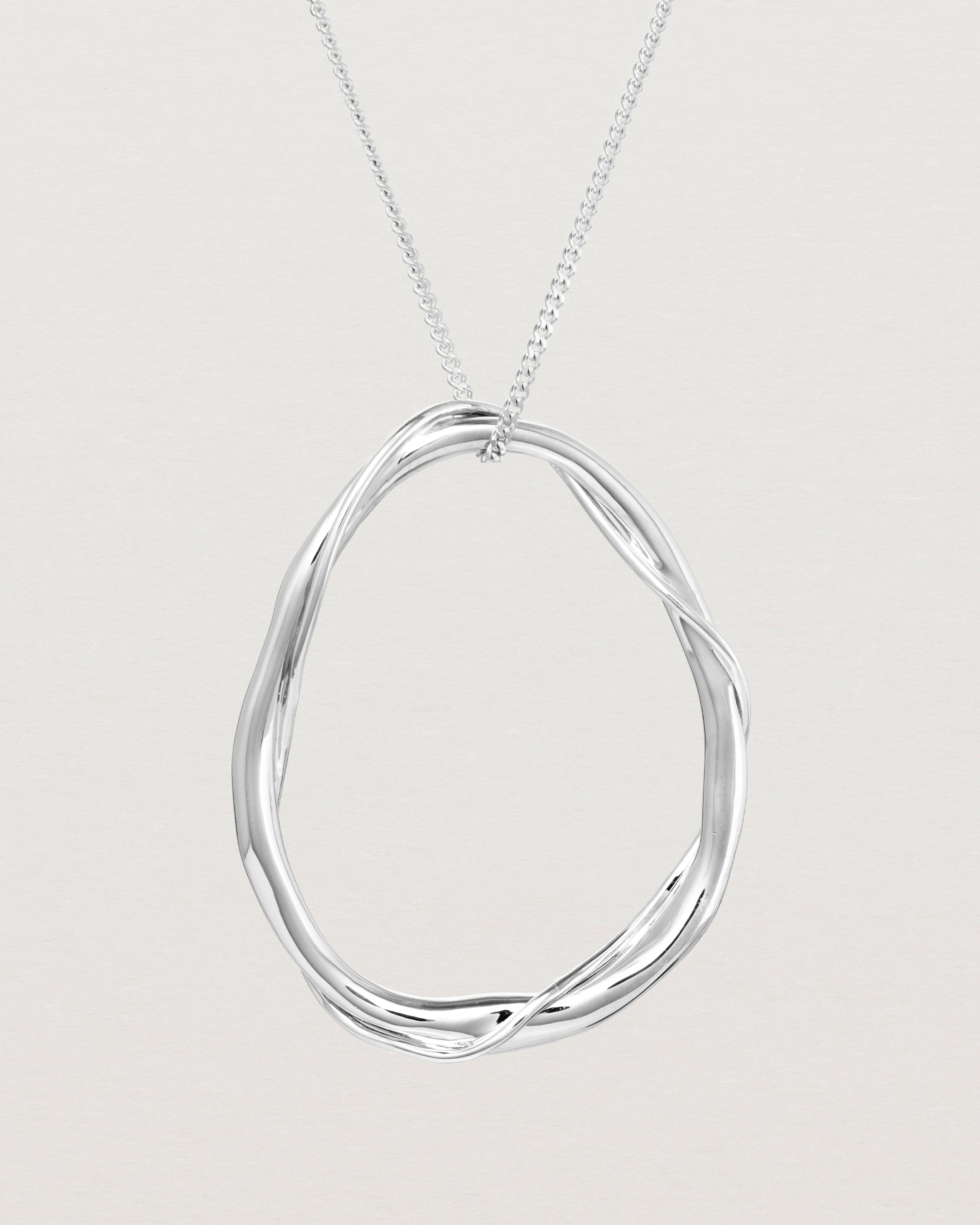 Close up view of the Dalí Necklace in sterling silver.