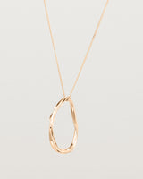 Angled view of the Dalí Necklace in rose gold.