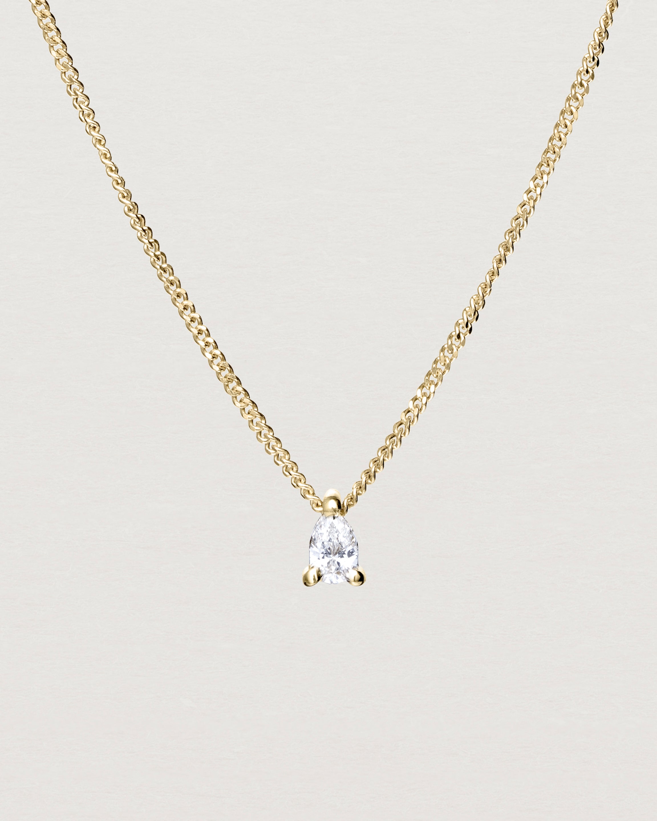 Close up view of the Danaë Slider Necklace | Diamond in yellow gold.