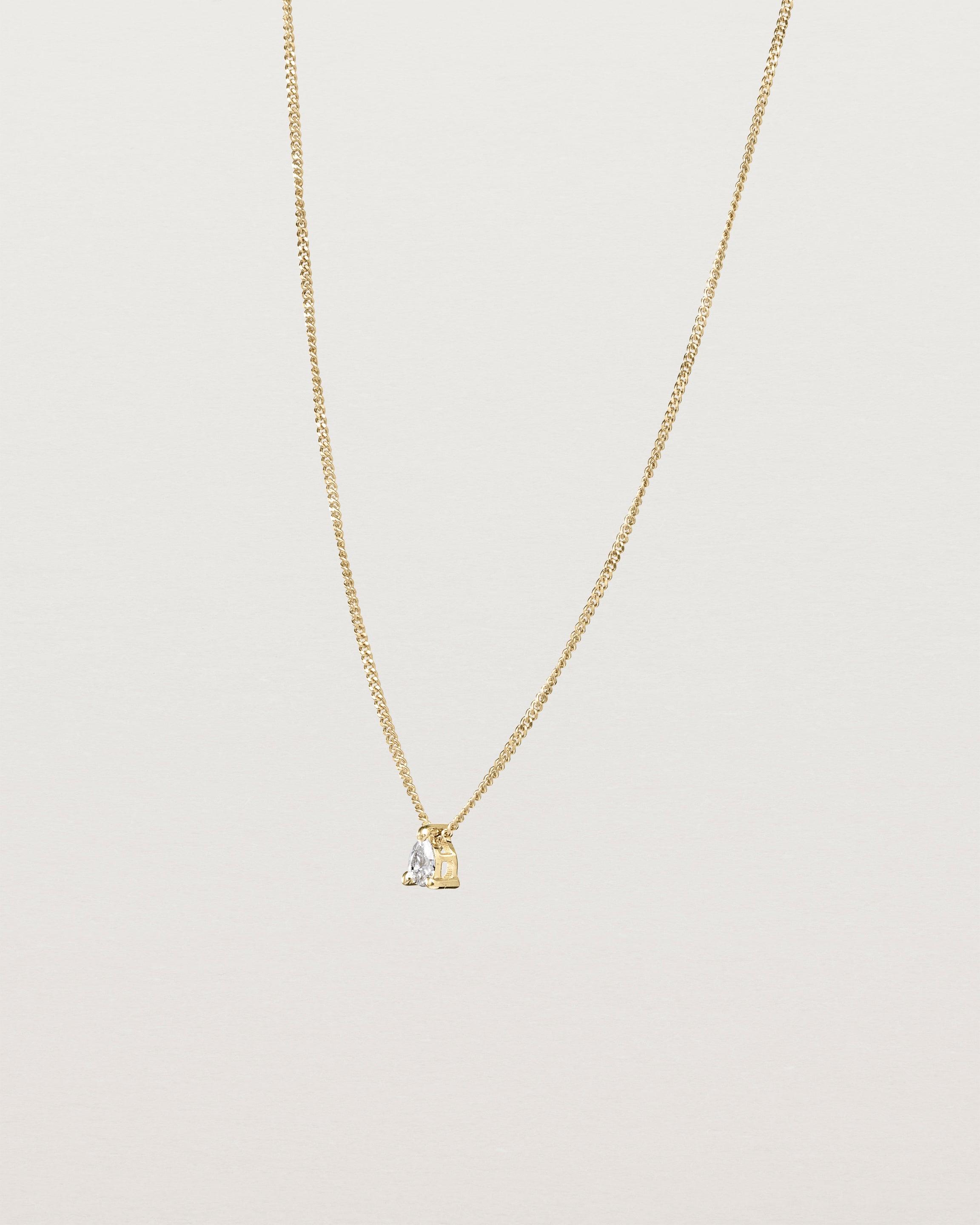 Angled view of the Danaë Slider Necklace | Diamond in yellow gold.