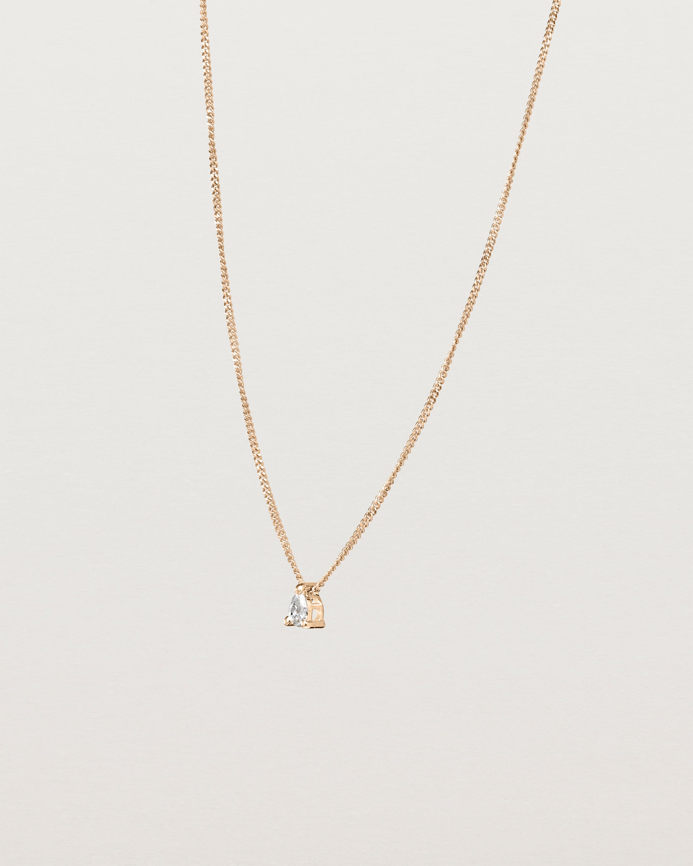 Angled view of the Danaë Slider Necklace | Diamond in rose gold.