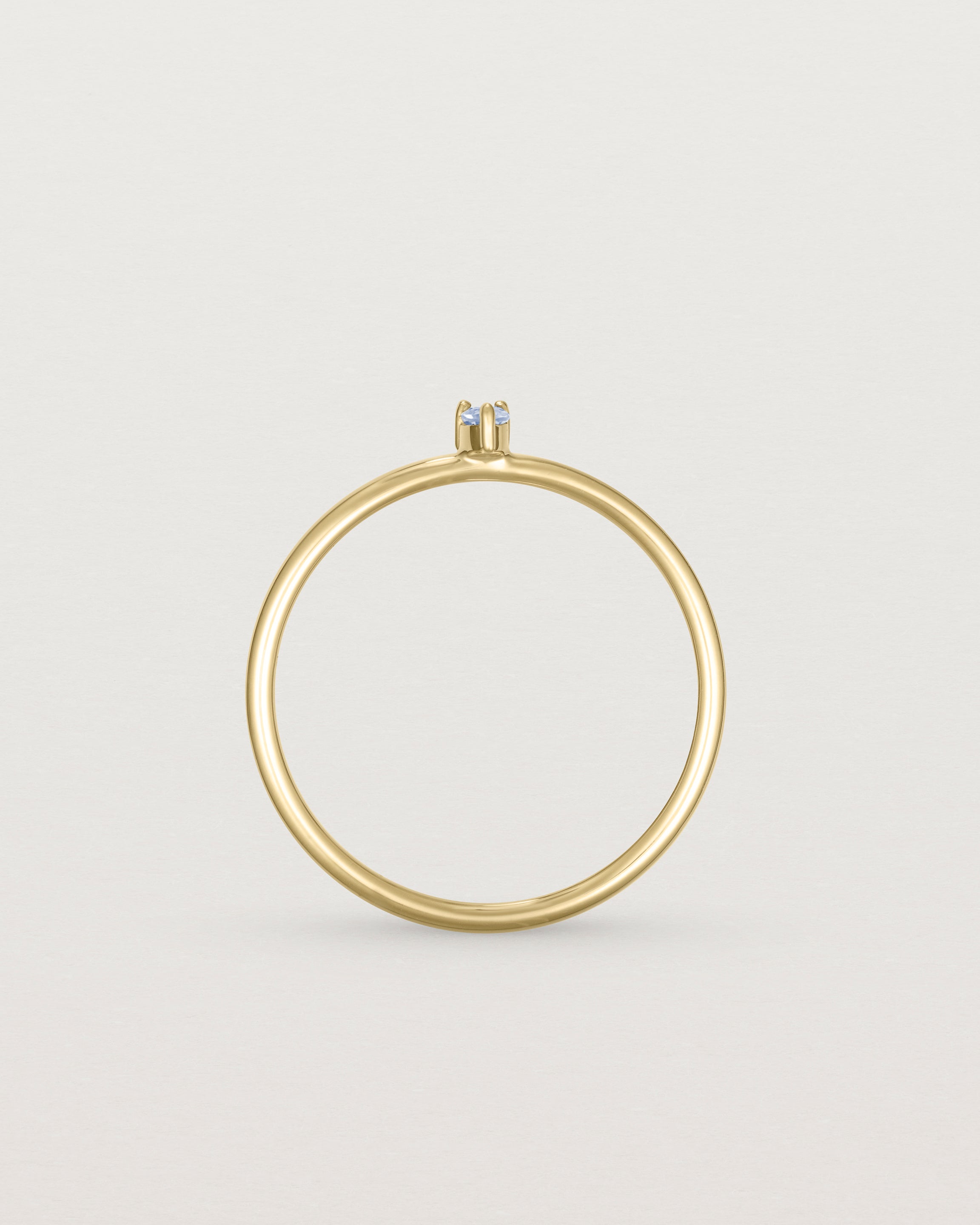 Standing view of the Danaë Stacking Ring | Sapphire in yellow gold.