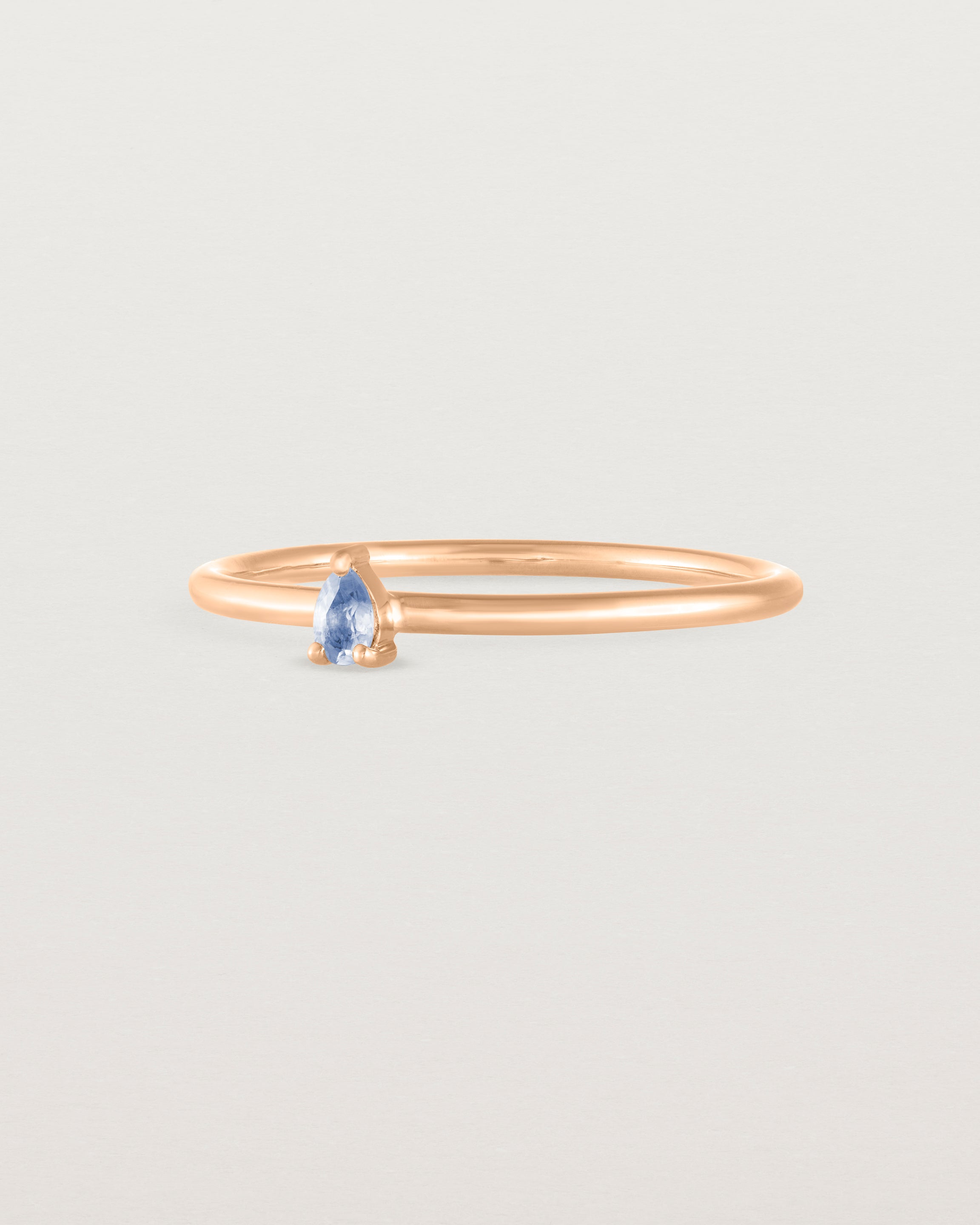 Angled view of the Danaë Stacking Ring | Sapphire in rose gold.