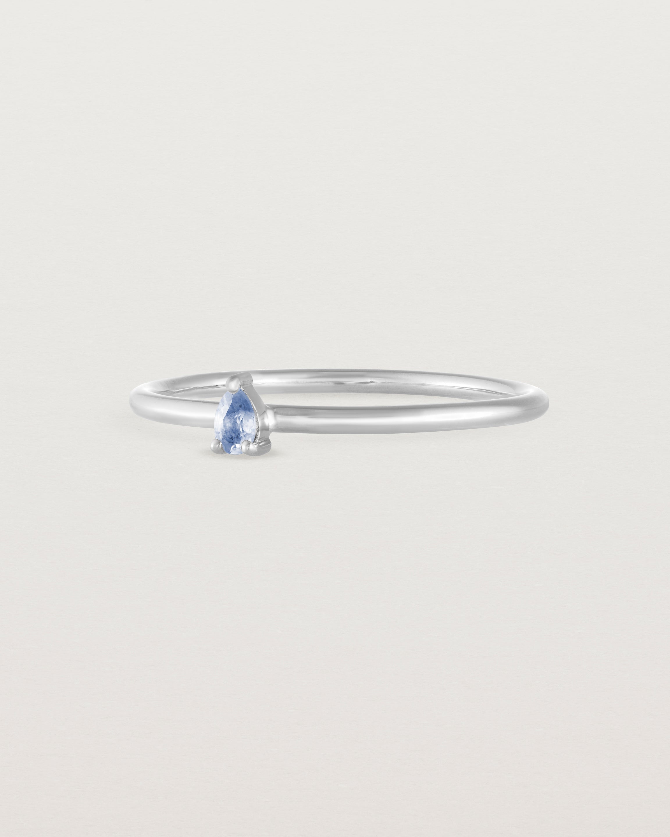 Angled view of the Danaë Stacking Ring | Sapphire in white gold.Front view of the Danaë Stacking Ring | Sapphire in white gold.
