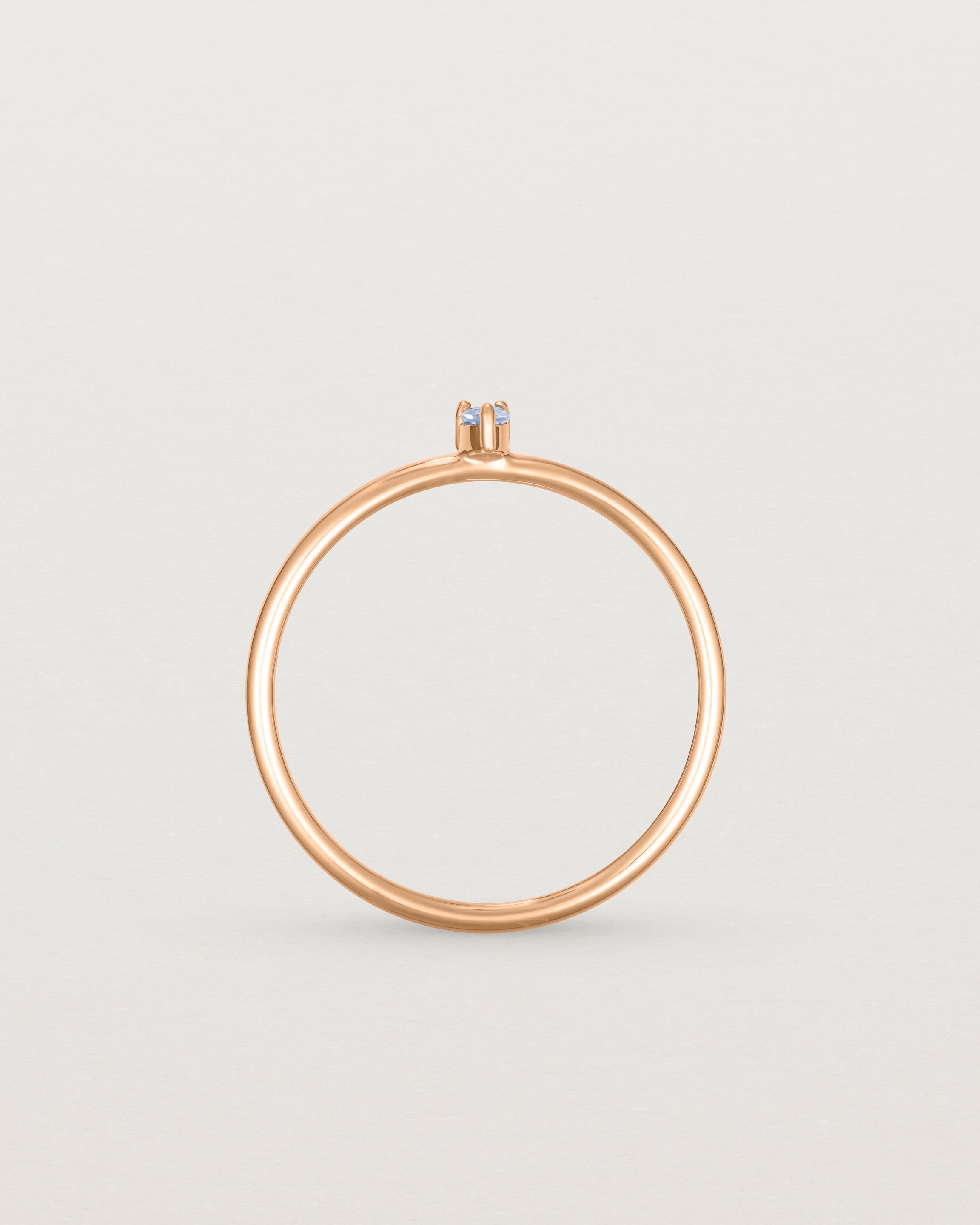 Standing view of the Danaë Stacking Ring | Sapphire in rose gold.