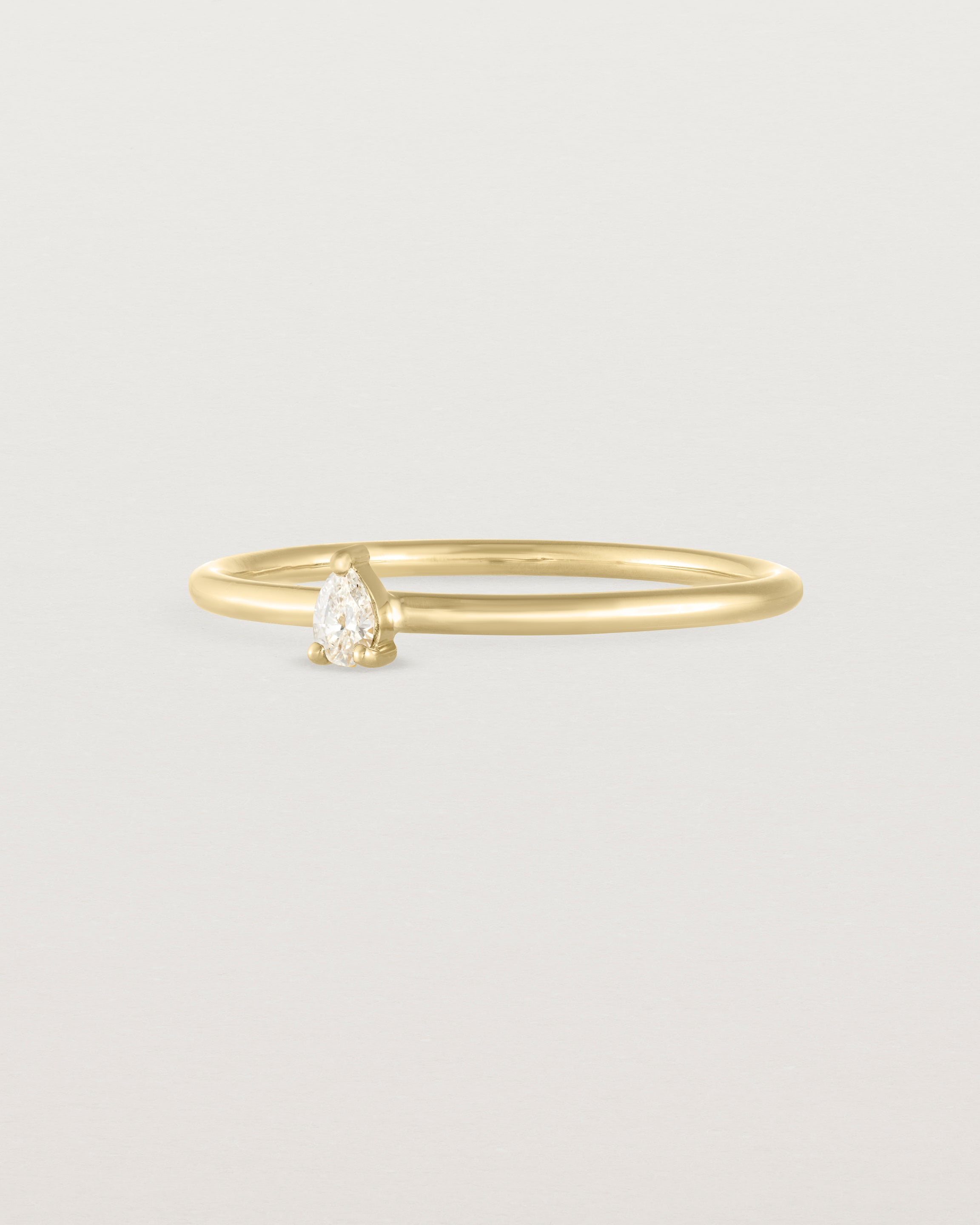 Angled view of the Danaë Stacking Ring | Diamond in yellow gold.