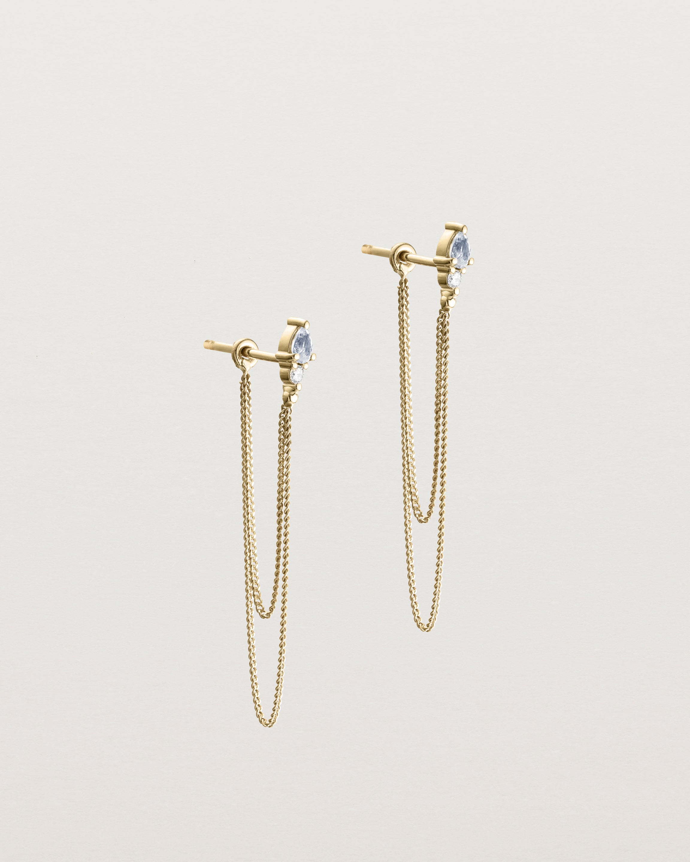 A pair of the Danaë Loop Studs | Sapphire & Diamond | Yellow Gold.