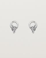 A pair of sterling silver studs with three mini hoops attached