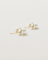 Angled view of the Sun Studs | Diamonds in yellow gold.