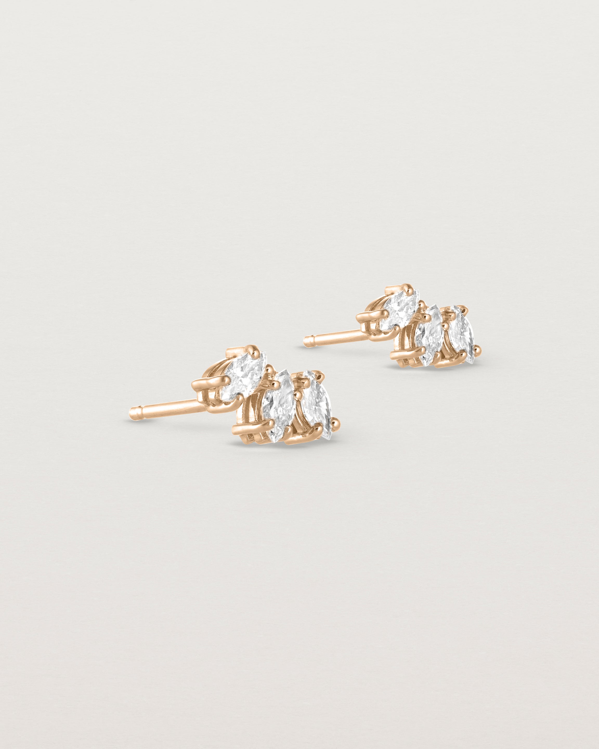 Angled view of the Sun Studs | Diamonds in rose gold.