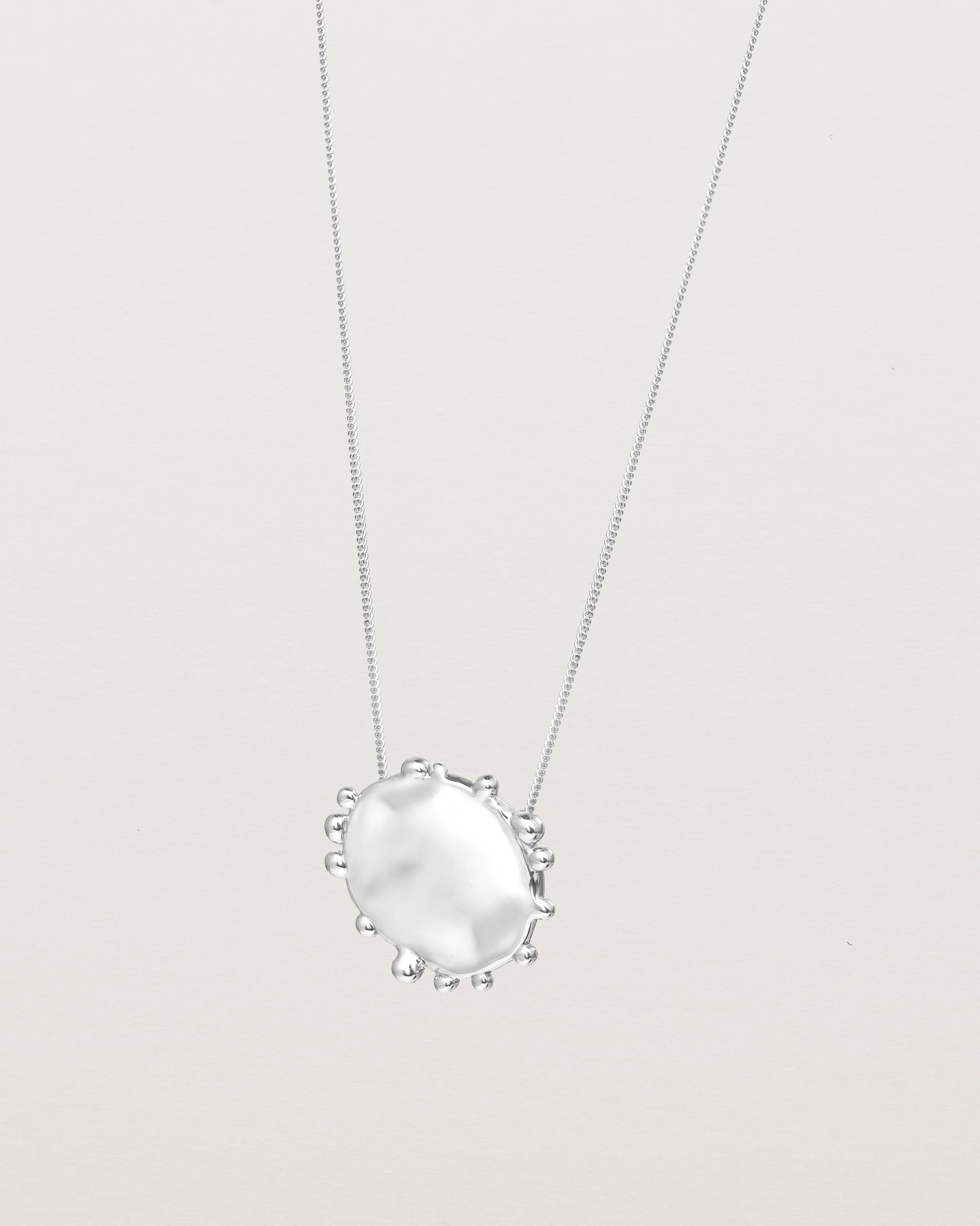 Angled view of the Dotted Mana Necklace in Sterling Silver