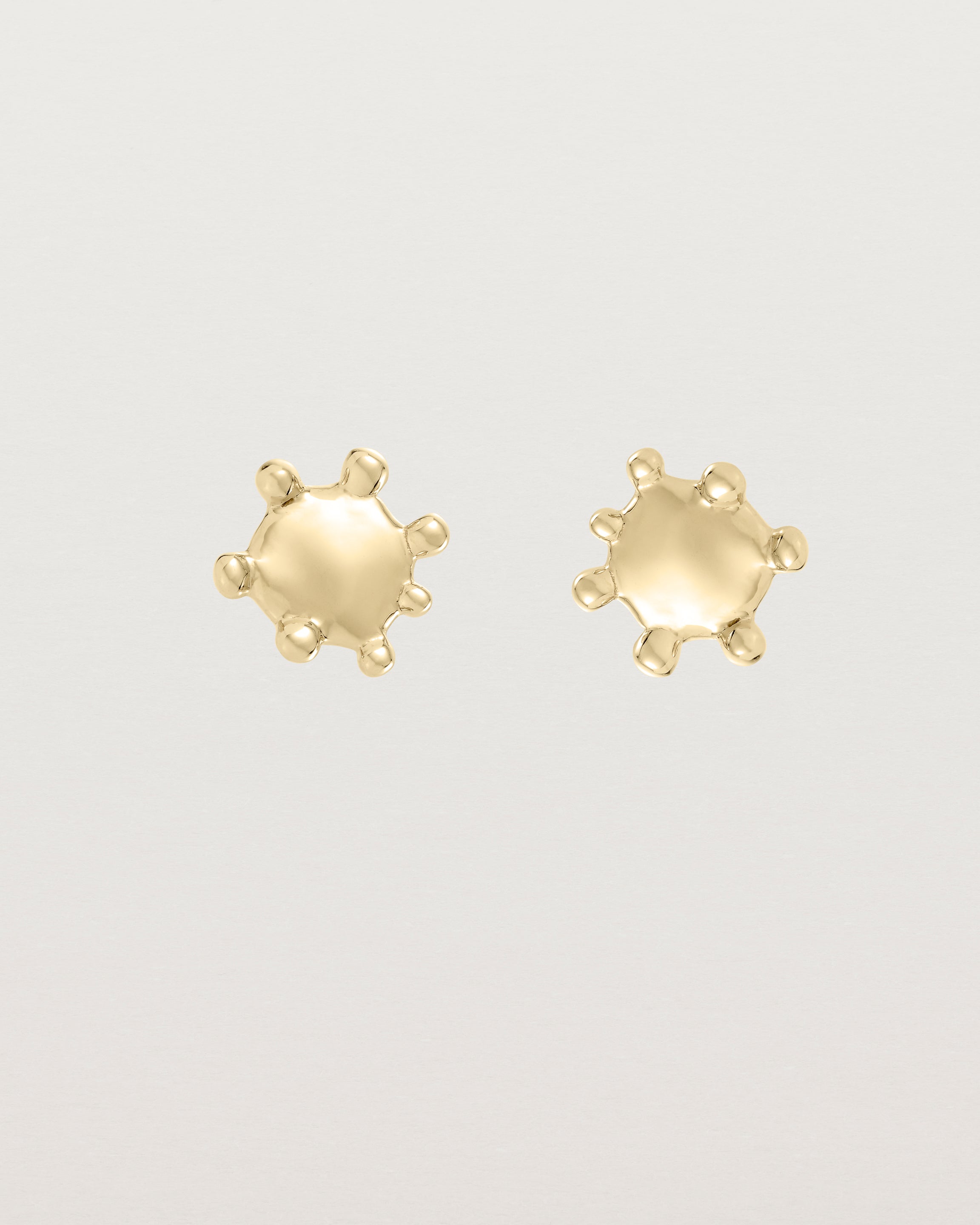 Front view of the Dotted Mana Studs in yellow gold.