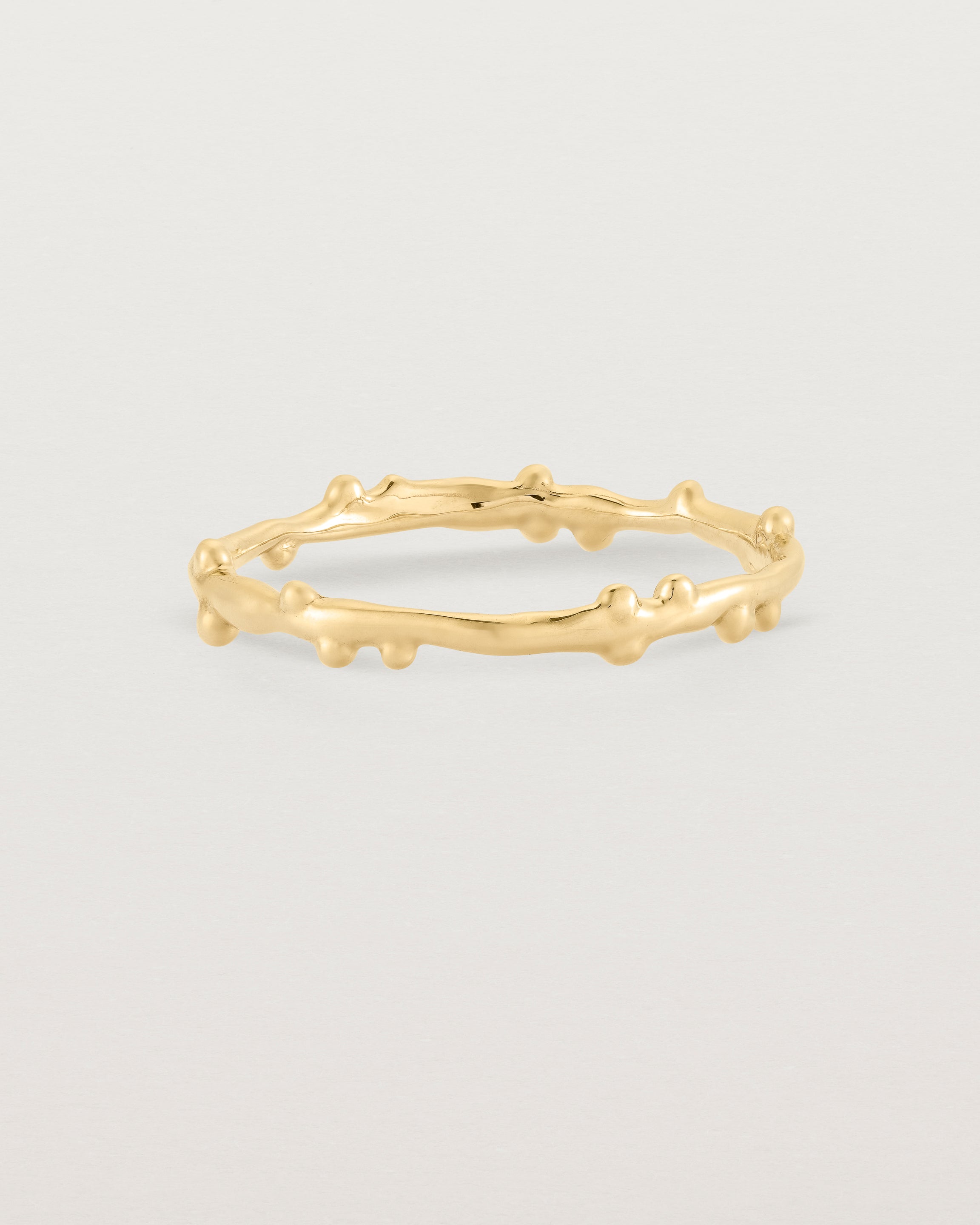 The Dotted Organic Stacking Ring in Yellow Gold.