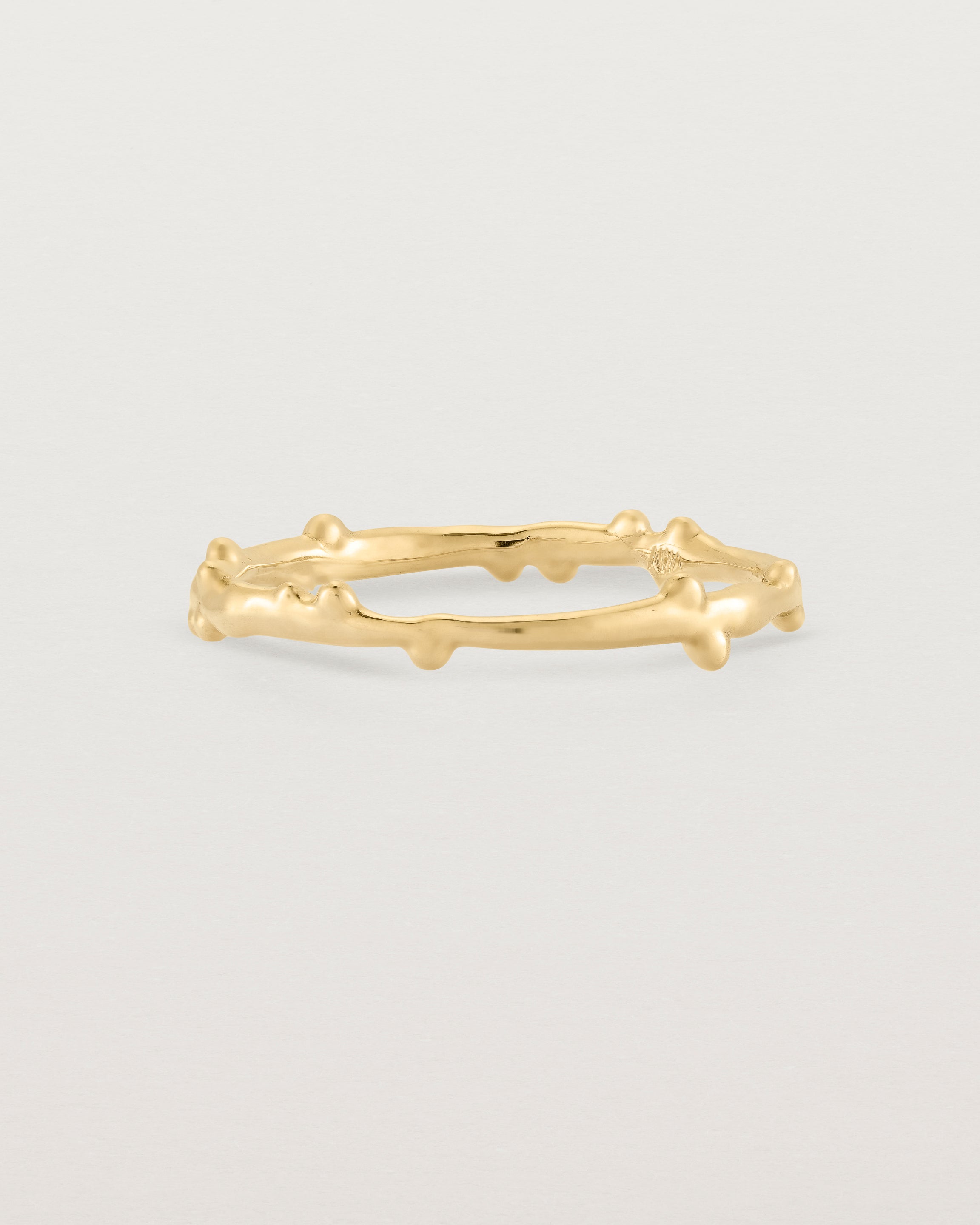 The Dotted Organic Stacking Ring in Yellow Gold.