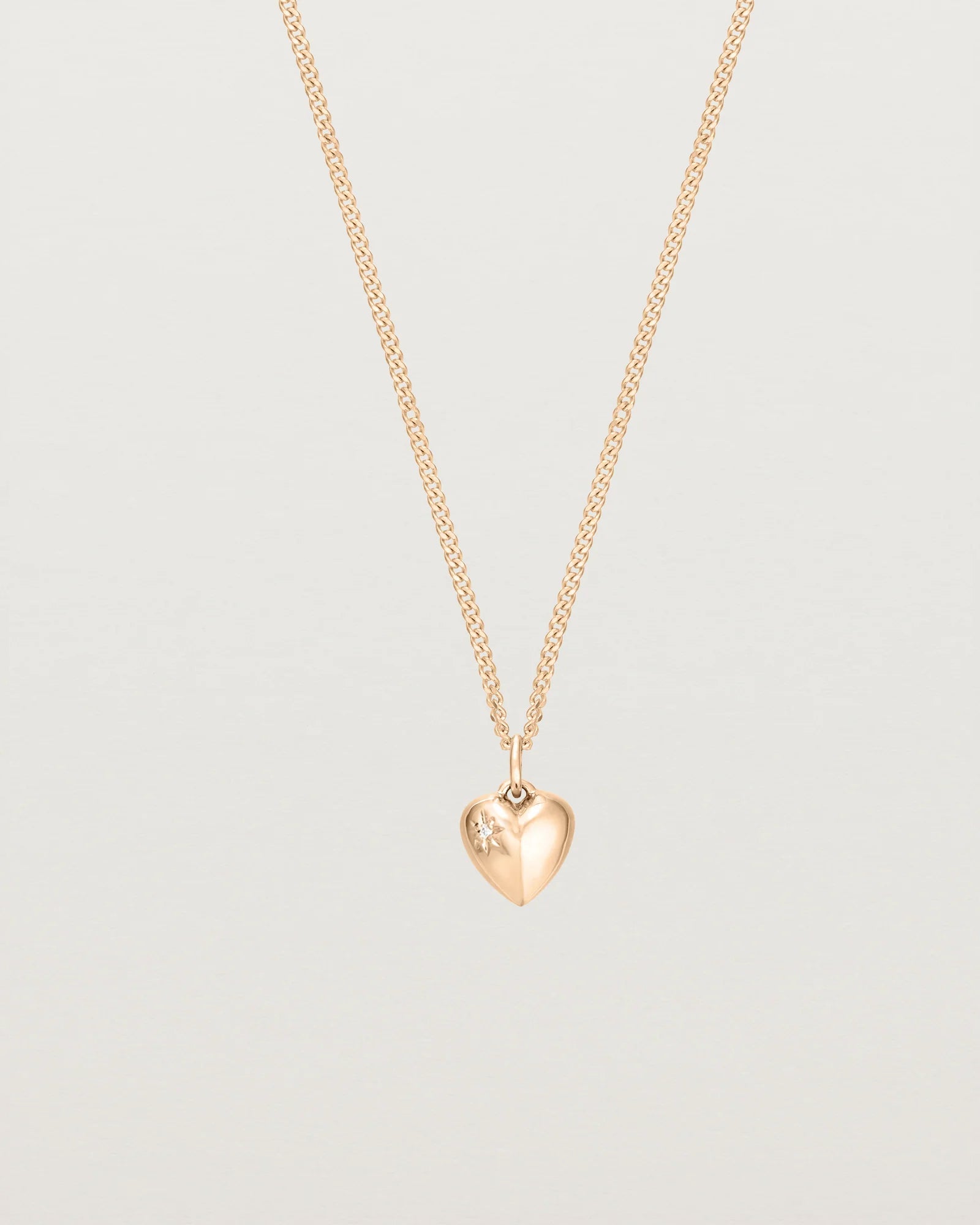 petits Ella Necklace with a White Star Set Diamond on the face of the heart pendant