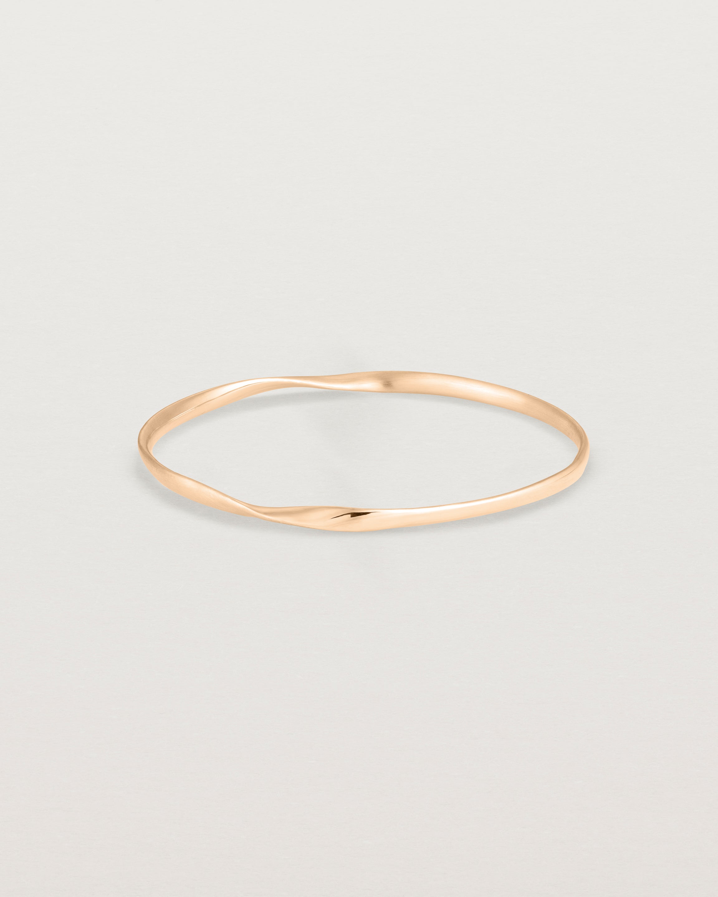 side view of the ellipse bangle in rose gold