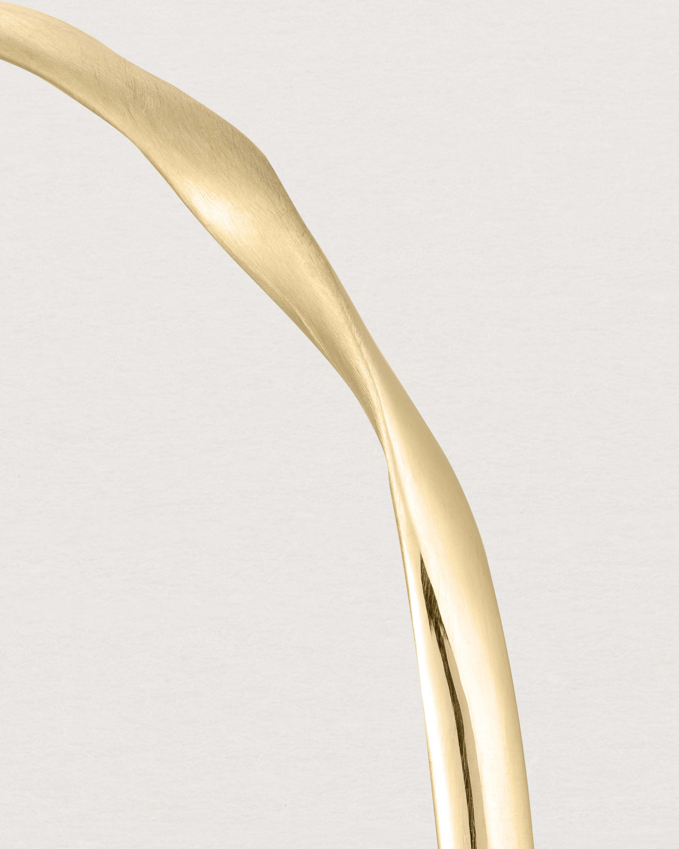 close up view of the ellipse bangle in yellow gold