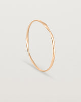 standing view of the ellipse bangle in rose gold