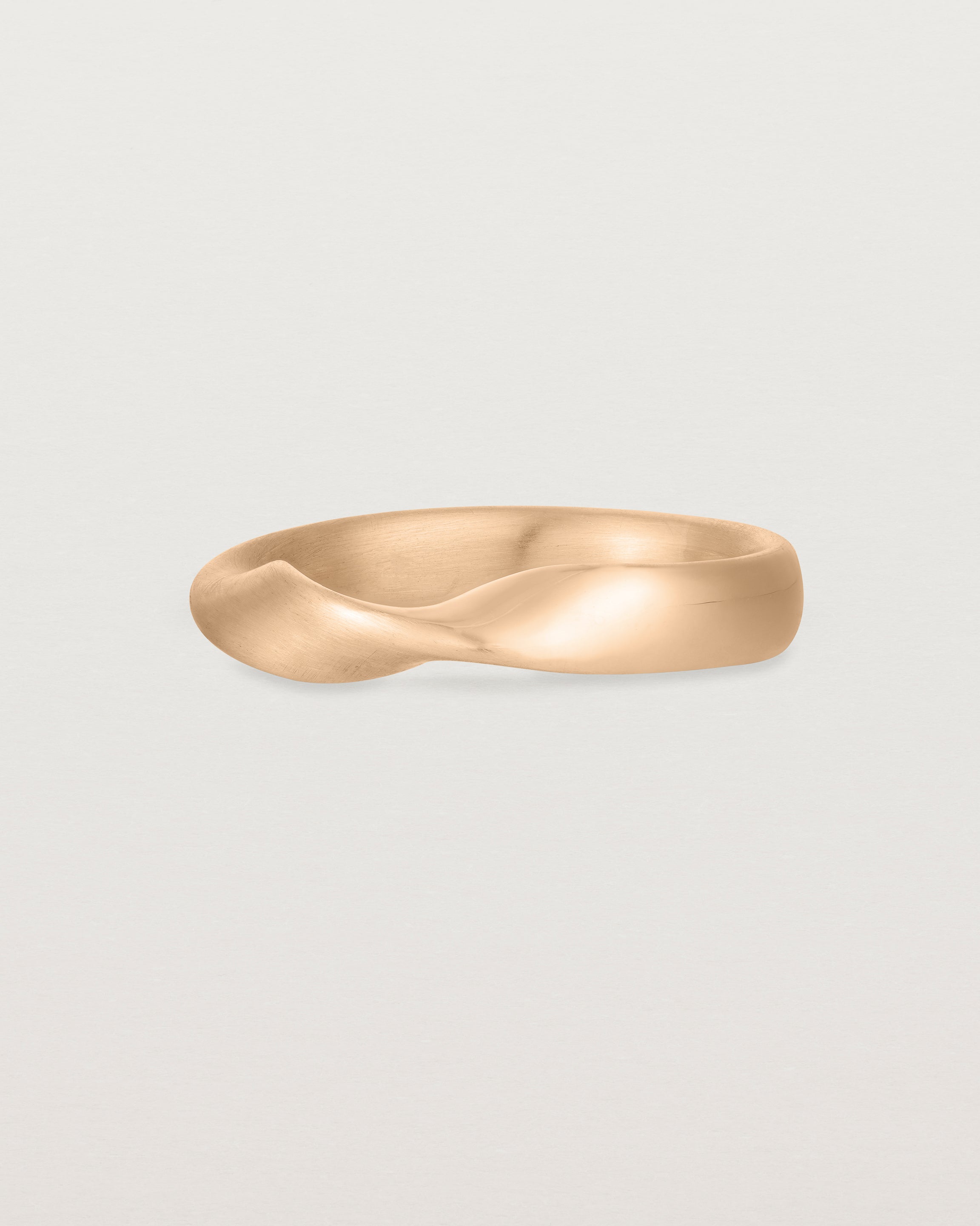 Angled view of the Ellipse / Shift Ring in Rose Gold.