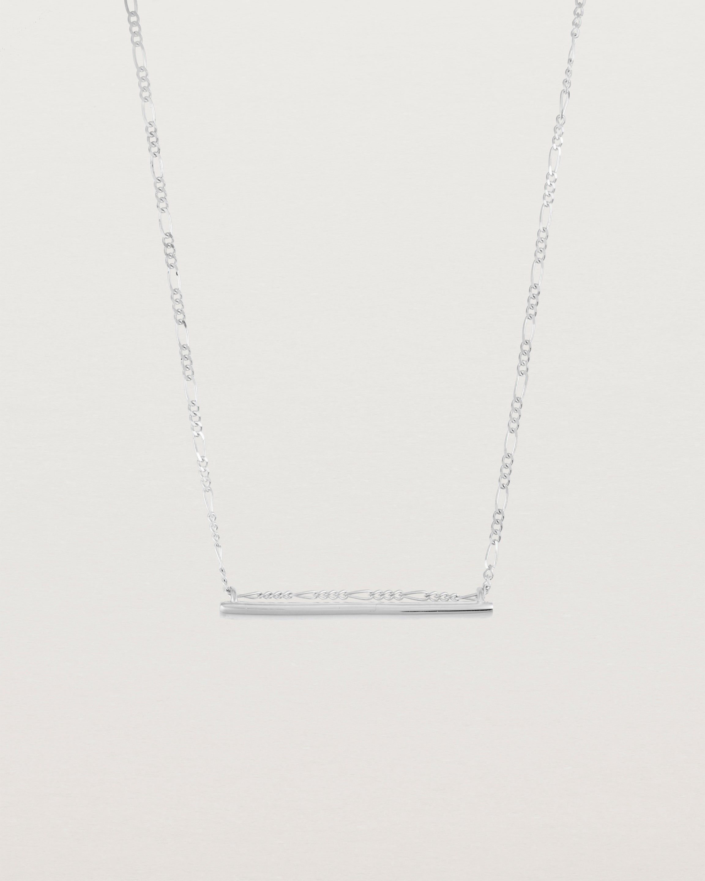 Ellipse necklace with a silver bar hanging from a chain in sterling silver