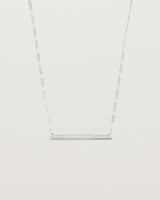 Ellipse necklace with a silver bar hanging from a chain in sterling silver