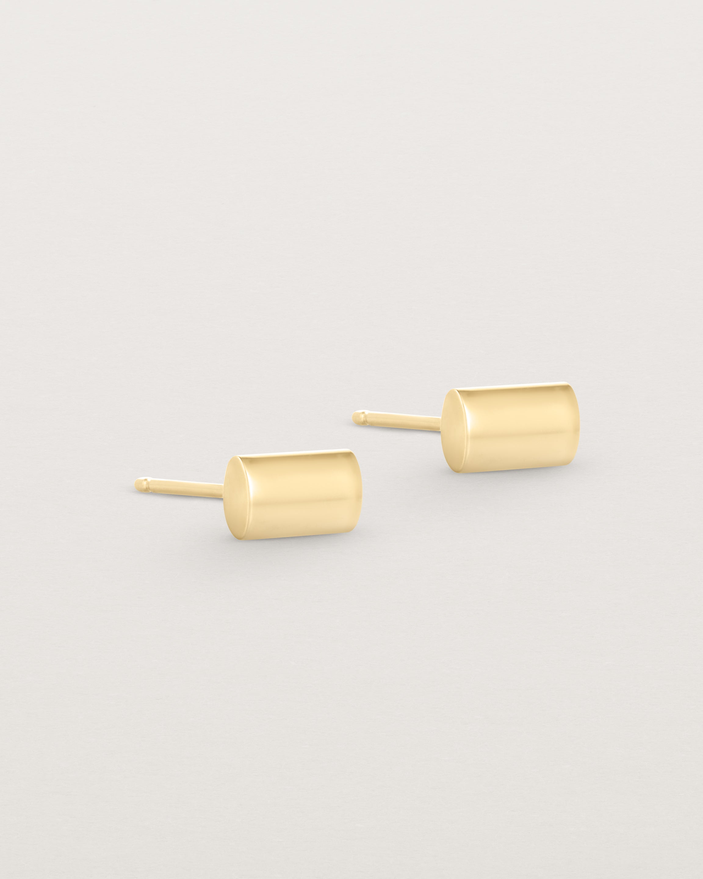 A pair of simple rectangle yellow gold studs
