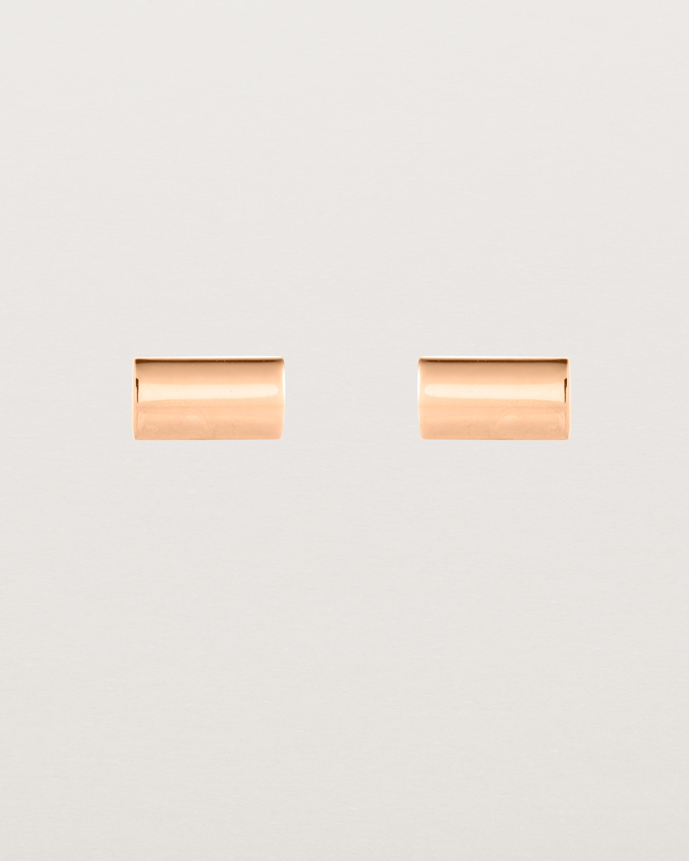 A pair of simple rectangle rose gold studs