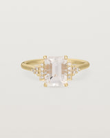 Front view of the Elodie Ring featuring a pale pink emerald cut morganite in yellow gold