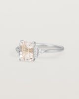 Side view of the Elodie Ring featuring a pale pink emerald cut morganite in white gold