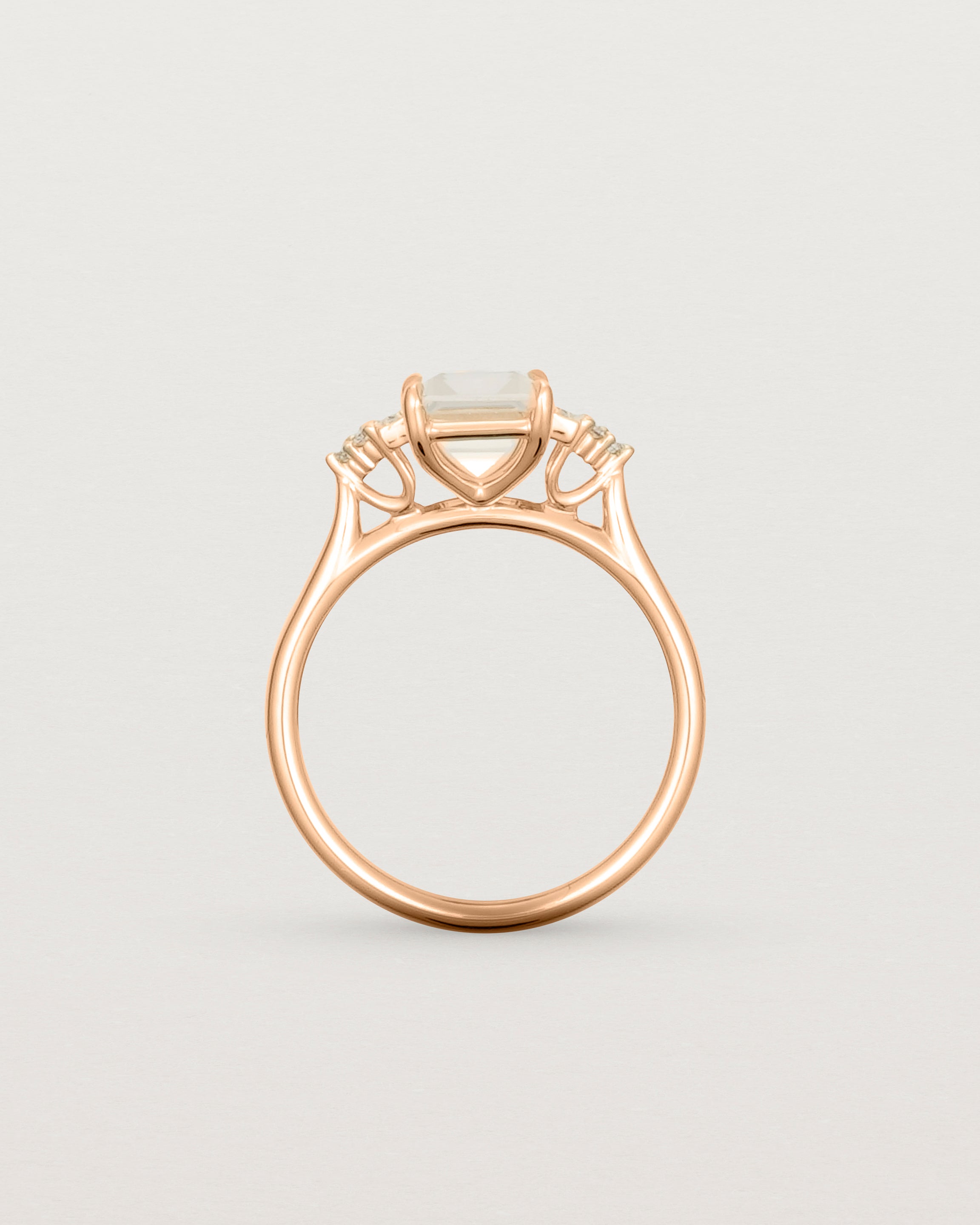 Standing view of the Elodie Ring featuring a pale pink emerald cut morganite in rose gold