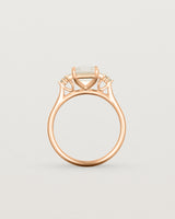 Standing view of the Elodie Ring featuring a pale pink emerald cut morganite in rose gold