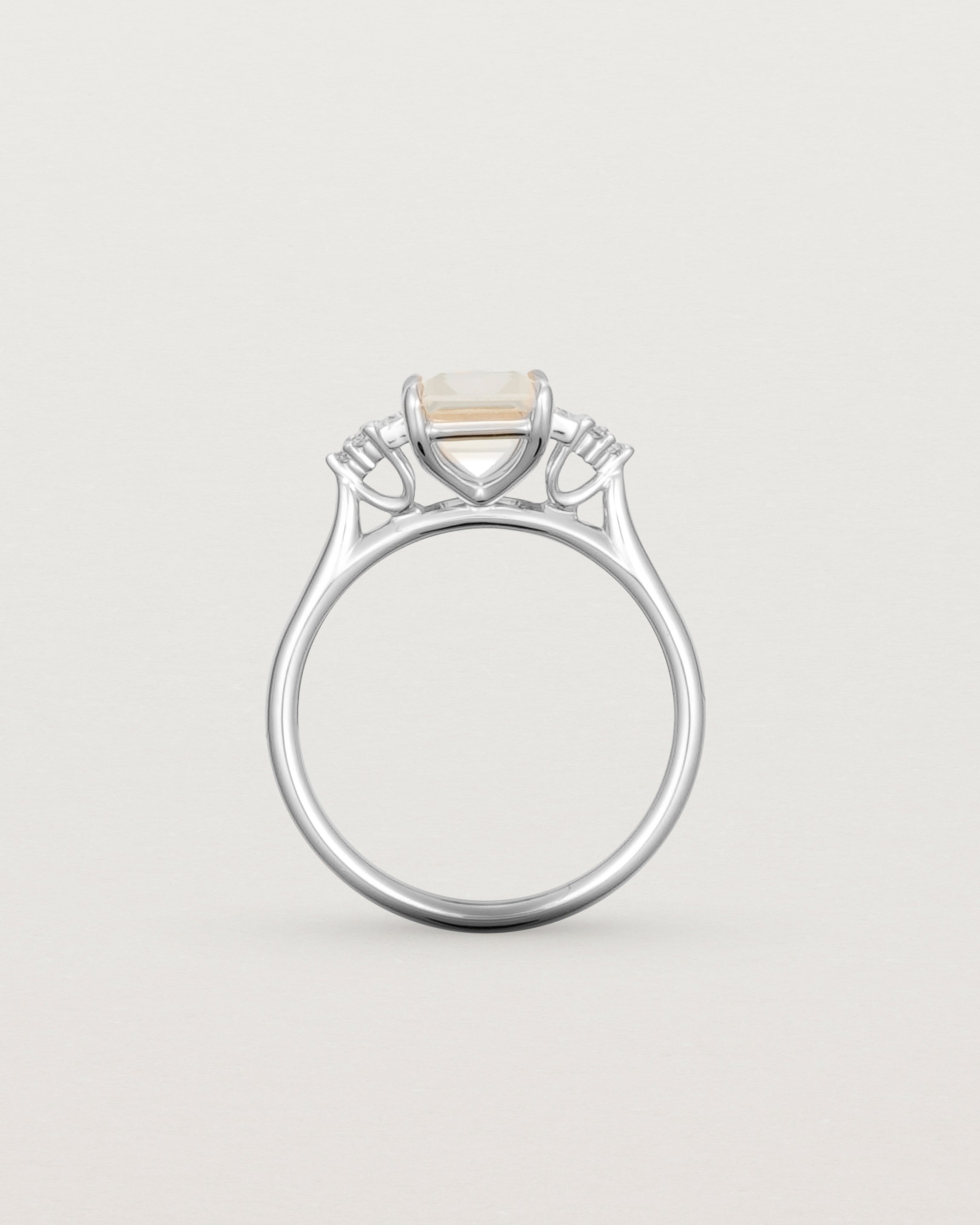 Standing view of the Elodie Ring featuring a pale pink emerald cut morganite in white gold