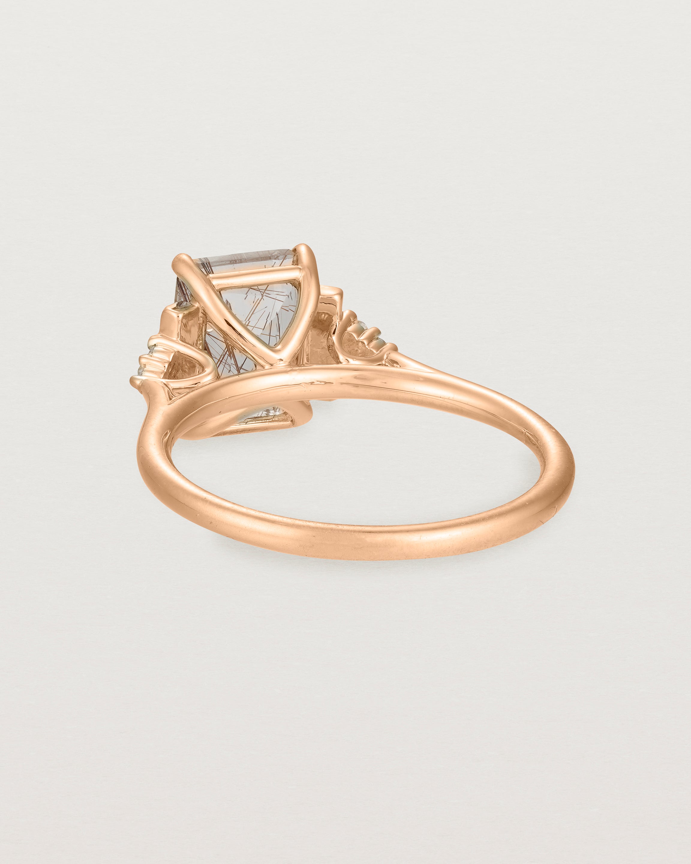 Back view of the Elodie Ring featuring a emerald cut rutilated quartz in yellow gold