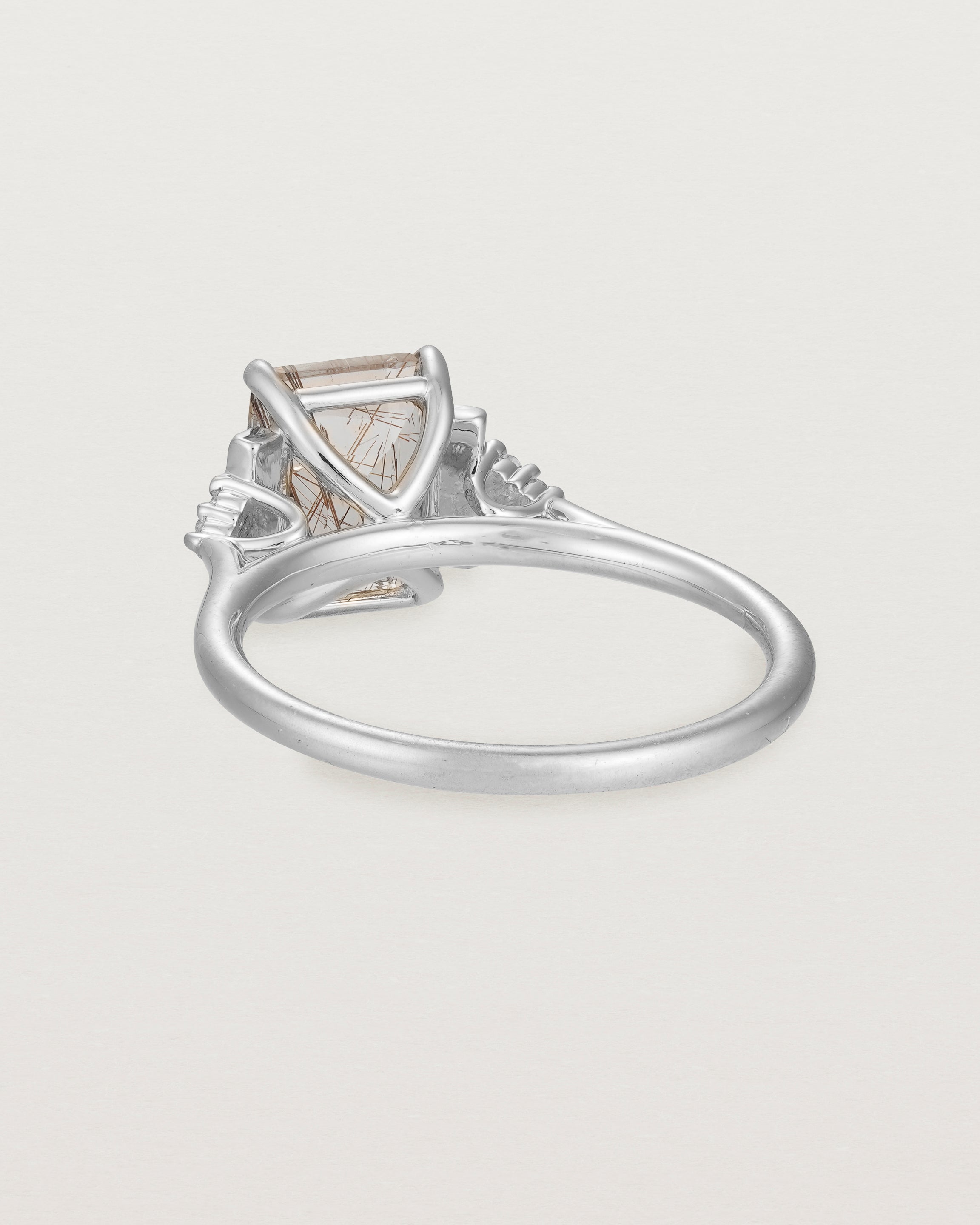 Back view of the Elodie Ring featuring a emerald cut rutilated quartz in white gold