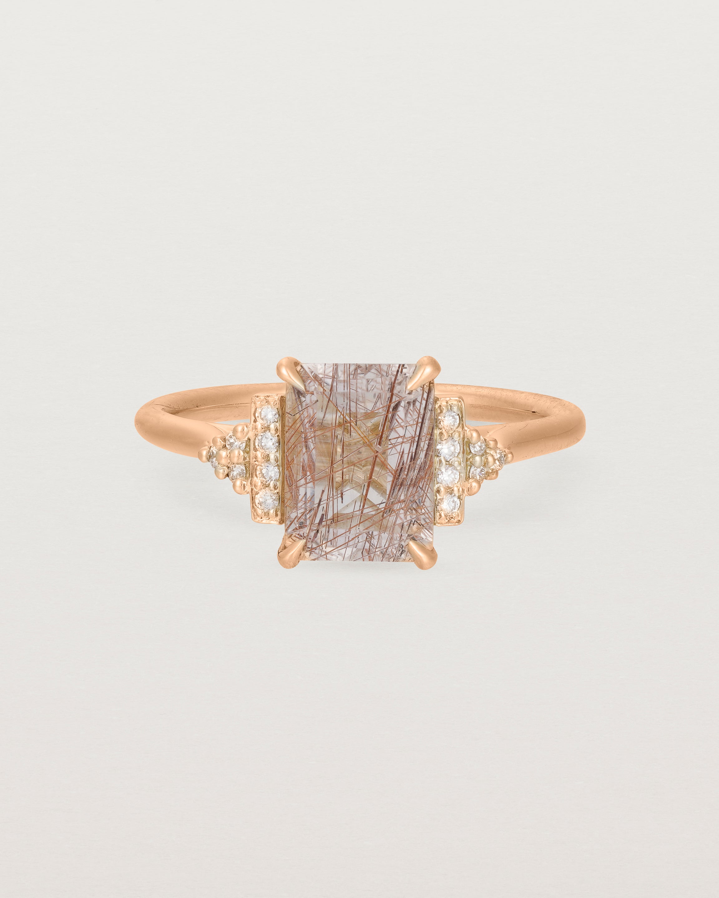 Front view of the Elodie Ring featuring a emerald cut rutilated quartz in yellow gold