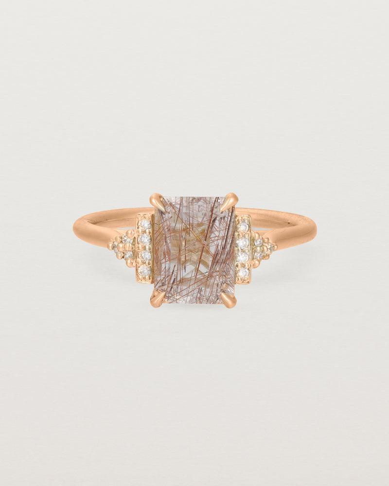 Front view of the Elodie Ring featuring a emerald cut rutilated quartz in yellow gold