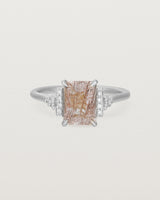 Front view of the Elodie Ring featuring a emerald cut rutilated quartz in white gold