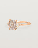 Side view of the Elodie Ring featuring a emerald cut rutilated quartz in yellow gold