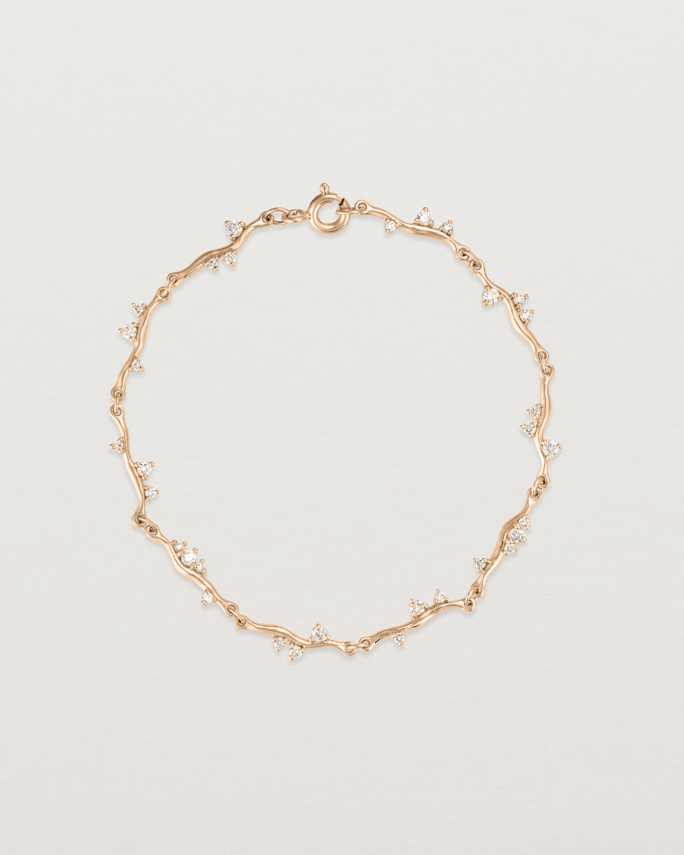 top view of ember bracelet with diamonds in rose gold