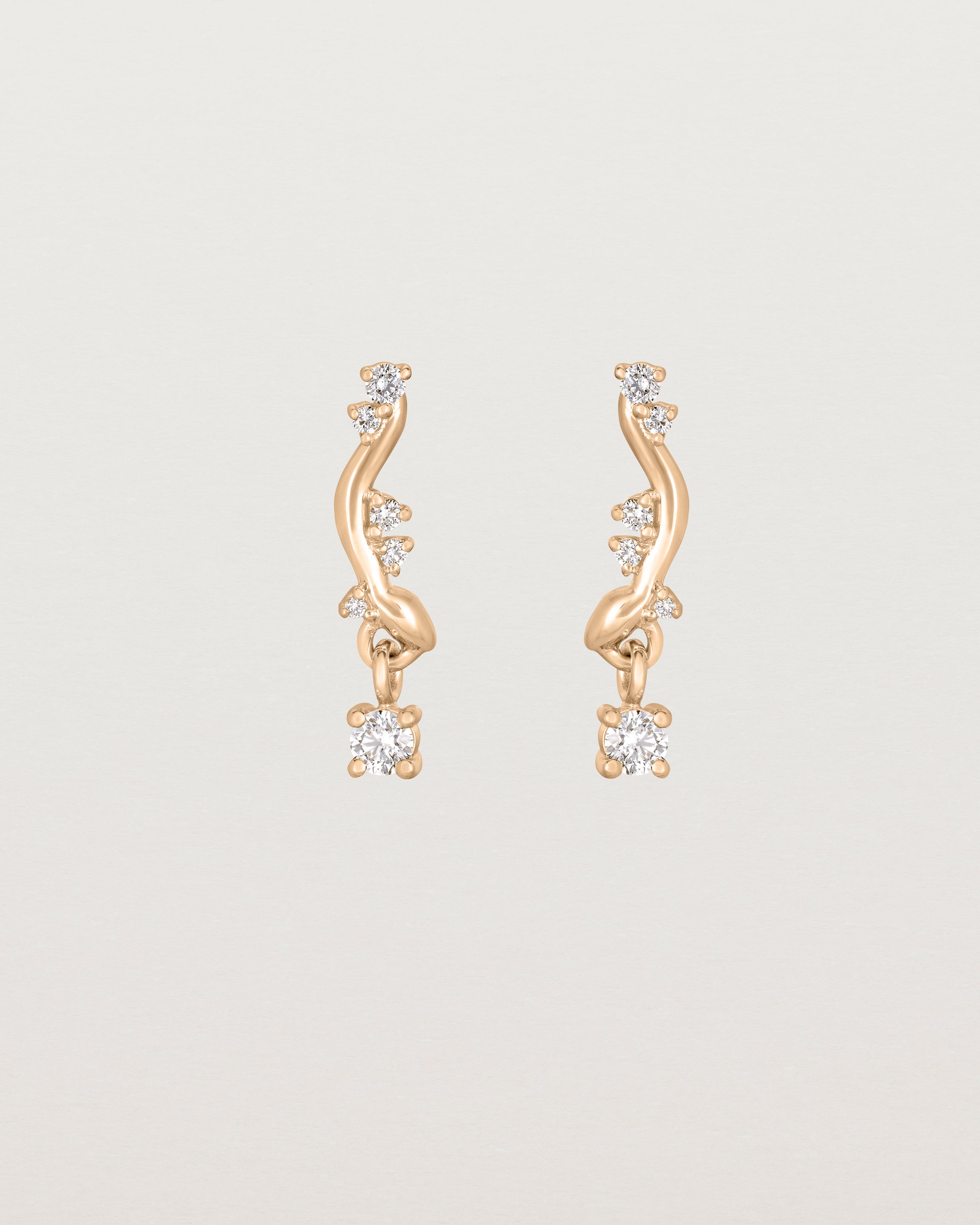 front image of diamond drop ember earrings in rose gold.